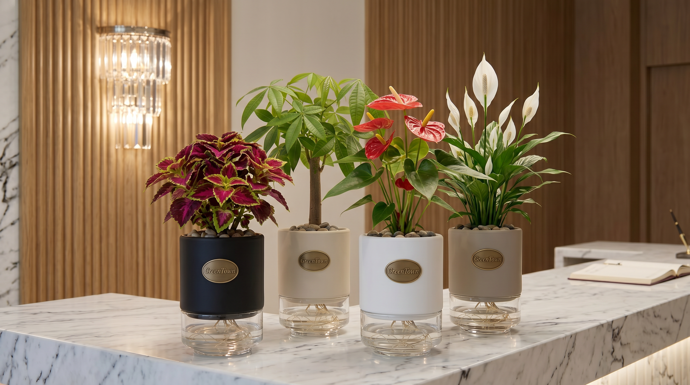A tight staggered cluster of four identical GreenTown vases on a polished white Carrara marble reception counter in a luxury Dubai boutique hotel lobby. Collars mixed across matte cream, black and warm stone-grey. Each vase holds a different plant — Coleus, Money Tree, Anthurium and Peace Lily — with pebbles in the top collar and pressed antique-brass medallions on the front faces.